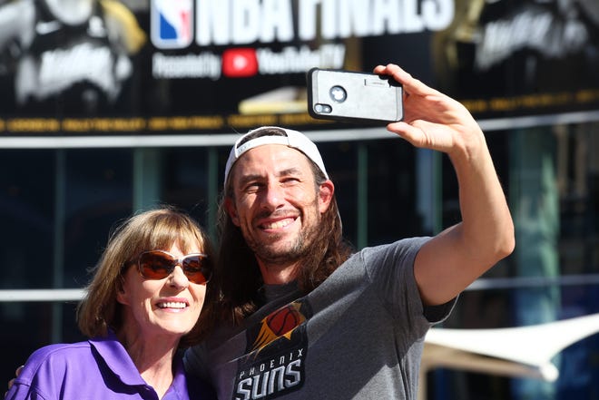 Virginia and Patrick Ford take a selfie at the Phoenix Suns Arena for Game 2 of the NBA finals vs. the Milwaukee Bucks on July 8, 2021.