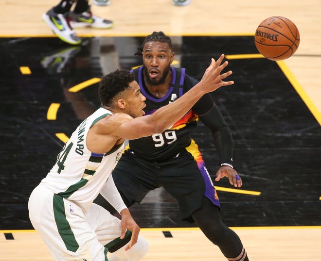 Phoenix Suns forward Jae Crowder (99) defends against Milwaukee Bucks forward Giannis Antetokounmpo (34) during Game 2 of the NBA Finals at Phoenix Suns Arena July 8, 2021.