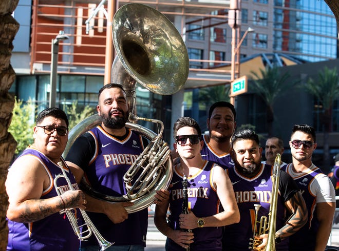 La Banda Alterada poses at the Phoenix Suns Arena for Game 2 of the NBA finals vs. the Milwaukee Bucks on July 8, 2021.