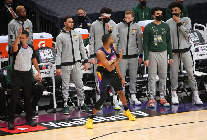 Phoenix Suns forward Mikal Bridges (25) turns towards the Milwaukee Bucks bench after hitting a three point basket during Game 2 of the NBA Finals at Phoenix Suns Arena July 8, 2021.