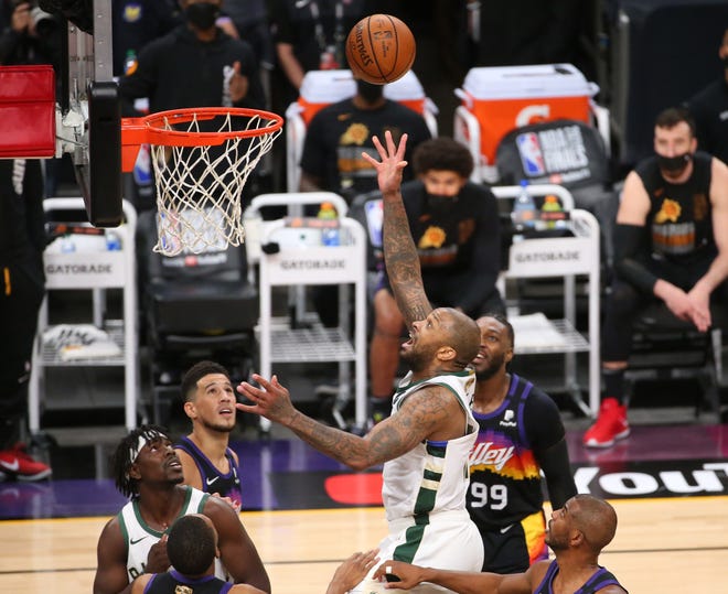 Milwaukee Bucks forward P.J. Tucker (17) lays the ball in against the Phoenix Suns during Game 2 of the NBA Finals at Phoenix Suns Arena July 8, 2021.