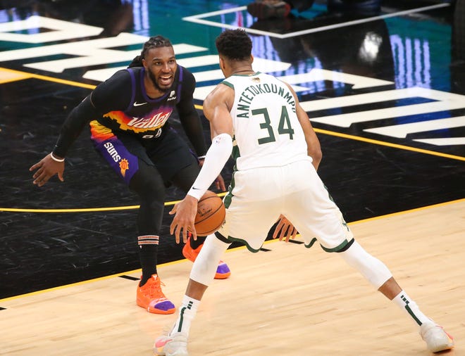 Phoenix Suns forward Jae Crowder (99) defends against Milwaukee Bucks forward Giannis Antetokounmpo (34) during Game 2 of the NBA Finals at Phoenix Suns Arena July 8, 2021.