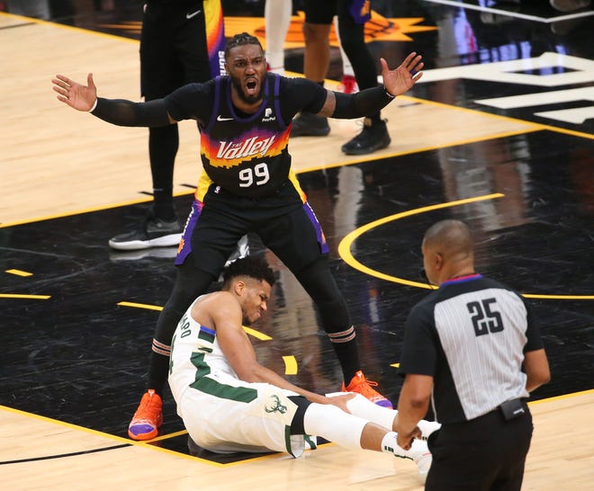 Phoenix Suns forward Jae Crowder (99) argues a foul call by referee Tony Brothers (25) for Milwaukee Bucks forward Giannis Antetokounmpo (34) during Game 2 of the NBA Finals at Phoenix Suns Arena July 8, 2021.