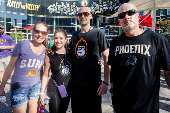 Angela, Daniella, Jerry and Mathew smile at the Phoenix Suns Arena for Game 2 of the NBA finals vs. the Milwaukee Bucks on July 8, 2021.