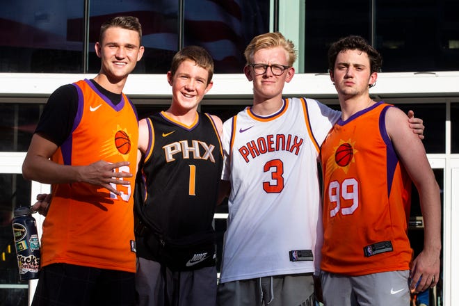From left, Suns fans Cooper Christensen, Coller Christensen, Tyson Emig and Bryson Christensen arrive at the Phoenix Suns Arena for Game 2 of the NBA finals vs. the Milwaukee Bucks on July 8, 2021.