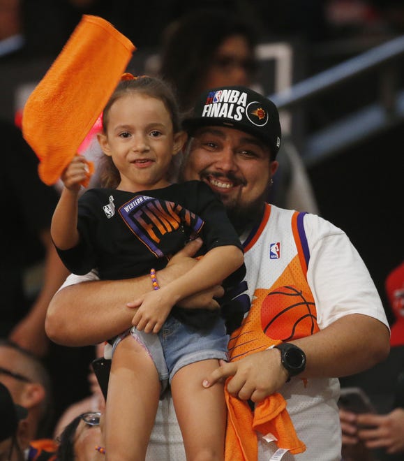 Fans watch the Phoenix Suns take on the Milwaukee Bucks during a Road Rally watch party of Game 3 of the NBA Finals at the Phoenix Suns Arena in downtown Phoenix on July 11, 2021.