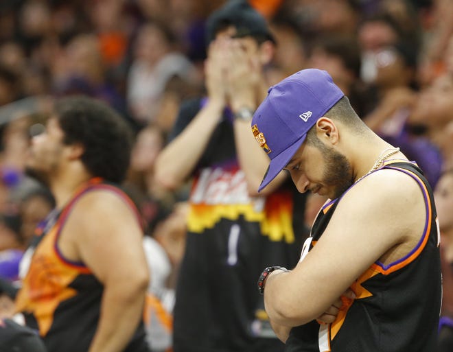 Suns fans react after an 18-0 run for the Milwaukee Bucks as the Phoenix Suns take on the Milwaukee Bucks during a Road Rally watch party for Game 3 of the NBA Finals at the Phoenix Suns Arena in downtown Phoenix on July 11, 2021.
