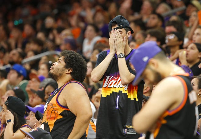 Suns fans react after an 18-0 run for the Milwaukee Bucks as the Phoenix Suns take on the Milwaukee Bucks during a Road Rally watch party for Game 3 of the NBA Finals at the Phoenix Suns Arena in downtown Phoenix on July 11, 2021.