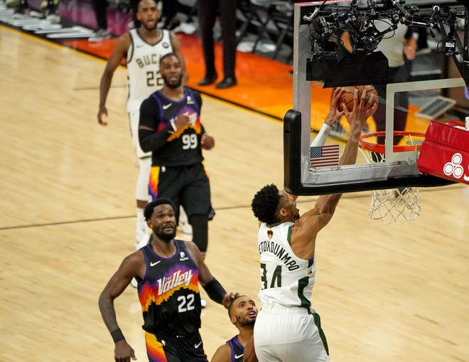 Milwaukee Bucks forward Giannis Antetokounmpo dunks at the final minutes the fourth quarter after a takeaway of Game 5 of Bucks 123-119 win over the Phoenix Suns in the NBA Finals at Footprint Center in Phoenix on Saturday.
