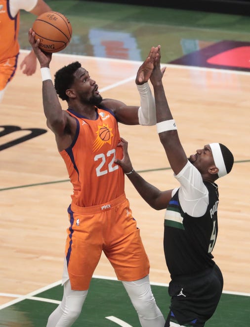 Phoenix Suns center Deandre Ayton (22) shoots over Milwaukee Bucks center Bobby Portis (9) during Game 6 of the NBA Finals at Fiserv Forum July 20, 2021.