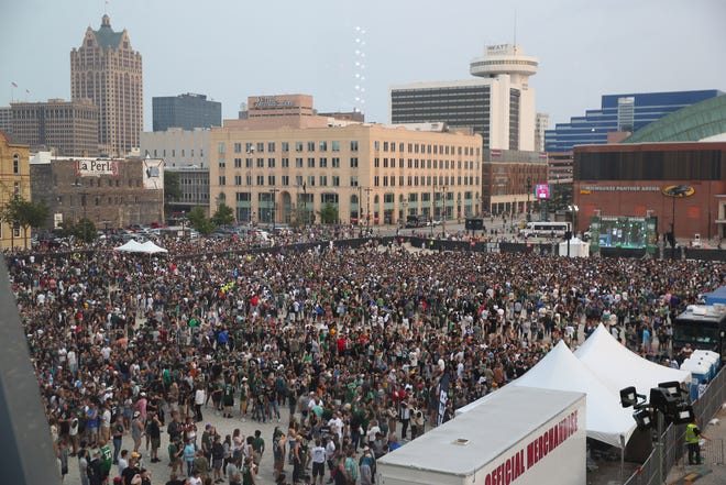 Fans gather outside Fiserv Forum to watch Game 6 of the NBA Finals between the Phoenix Suns and the Milwaukee Bucks July 20, 2021.