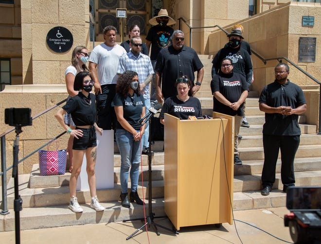 Amy Meglio, an organizer with the W.E. Rising Project and NoCap, speaks during a news conference at Cesar Chavez Plaza in downtown Phoenix on Aug. 6, 2021. The gathering was a response to the Department of Justice's investigation into the Phoenix Police Department.