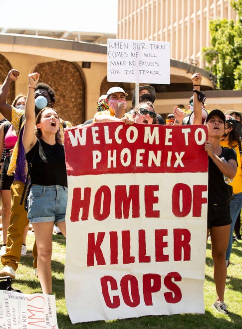 Protesters demonstrate outside Phoenix City Hall as the City Council holds a virtual meeting in the aftermath of the death of George Floyd, who died in police custody on May 25, 2020, in Minneapolis, Phoenix, June 3, 2020.