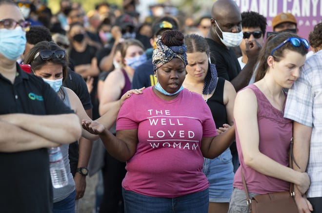 Protesters with AZ Churches Stand Together rally at Wesley Bolin Memorial Plaza, in Phoenix on June 2, 2020, to sing, pray and lament the death of George Floyd, who died in police custody on May 25, 2020, in Minneapolis.