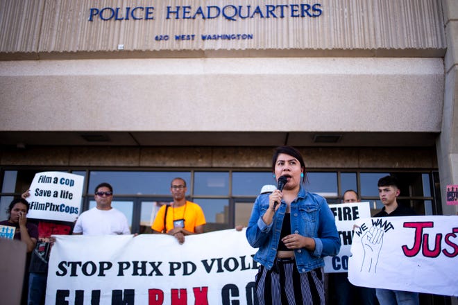 Viri Hernandez of Poder in Action speaks during a protest on Friday, June 21, 2019, outside Phoenix Police Department Headquarters in Phoenix. After Alejandro Hernandez and Hector Lopez were fatally shot by police in separate incidents, the department has refused to give either family the police reports.