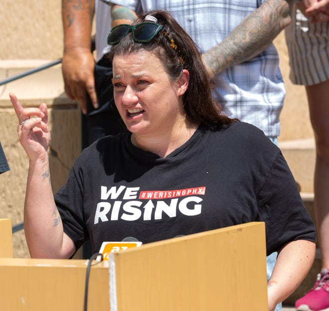 Amy Meglio, an organizer with the W.E. Rising Project and NoCap, speaks during a news conference at Cesar Chavez Plaza in downtown Phoenix on Aug. 6, 2021. The gathering was a response to the Department of Justice's investigation into the Phoenix Police Department.