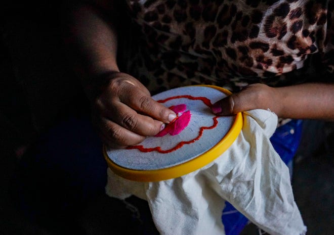 A Guatemalan mother sews in her rental apartment in Nogales, Sonora, where hundreds of people have been stranded under the Migrant Protection Protocols.