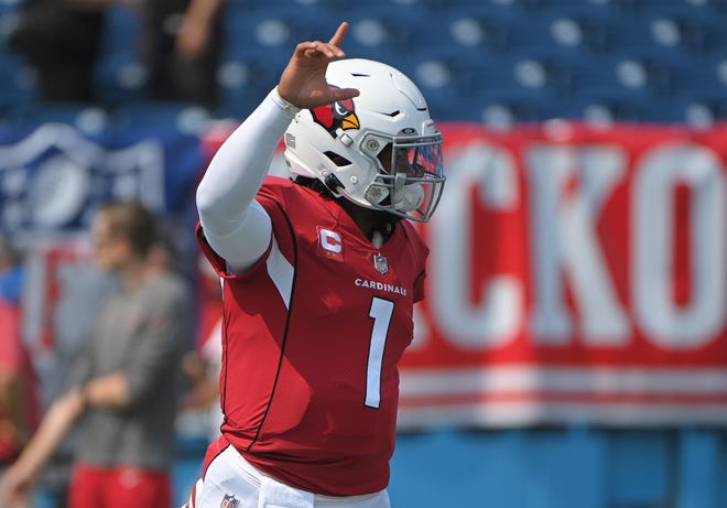 Sep 12, 2021; Nashville, Tennessee, USA;  Arizona Cardinals quarterback Kyler Murray (1) holds up a his hand against the Tennessee Titans before the game at Nissan Stadium. Mandatory Credit: Steve Roberts-USA TODAY Sports
