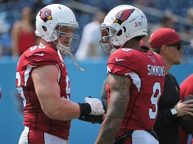 Sep 12, 2021; Nashville, Tennessee, USA; Arizona Cardinals defensive end J.J. Watt (99) talks with linebacker Isaiah Simmons (9)  before the game against the Tennessee Titans at Nissan Stadium. Mandatory Credit: Steve Roberts-USA TODAY Sports