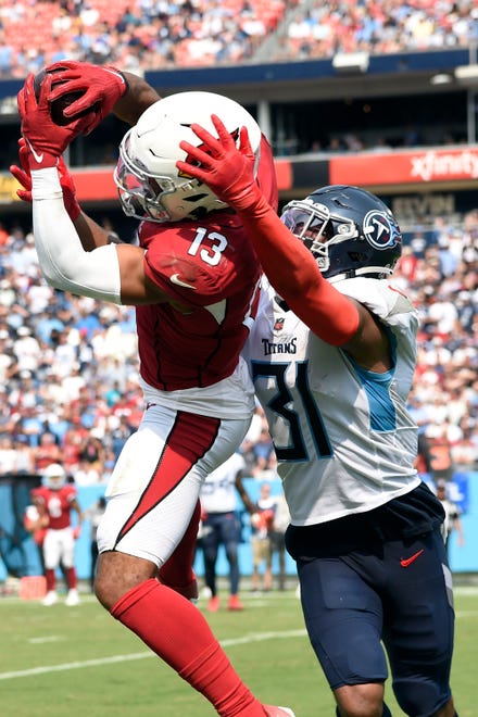 Arizona Cardinals wide receiver Christian Kirk (13) pulls down a touchdown over Tennessee Titans free safety Kevin Byard (31) during the third quarter at Nissan Stadium Sunday, Sept. 12, 2021 in Nashville, Tenn.

Titans Cards 198