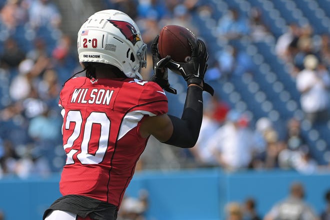 Sep 12, 2021; Nashville, Tennessee, USA;  Arizona Cardinals cornerback Marco Wilson (20) makes a catch against the Tennessee Titans before the game at Nissan Stadium. Mandatory Credit: Steve Roberts-USA TODAY Sports