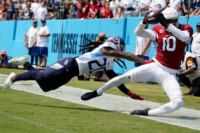 Arizona Cardinals wide receiver DeAndre Hopkins (10) scores a touchdown under pressure from Tennessee Titans cornerback Janoris Jenkins (20) during the first quarter at Nissan Stadium Sunday, Sept. 12, 2021 in Nashville, Tenn.

Titans Cards 094