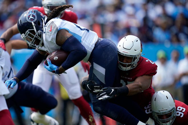 Tennessee Titans running back Derrick Henry (22) is tackled by Arizona Cardinals linebacker Zaven Collins (25) during the first quarter at Nissan Stadium Sunday, Sept. 12, 2021 in Nashville, Tenn.

Titans Cards 107