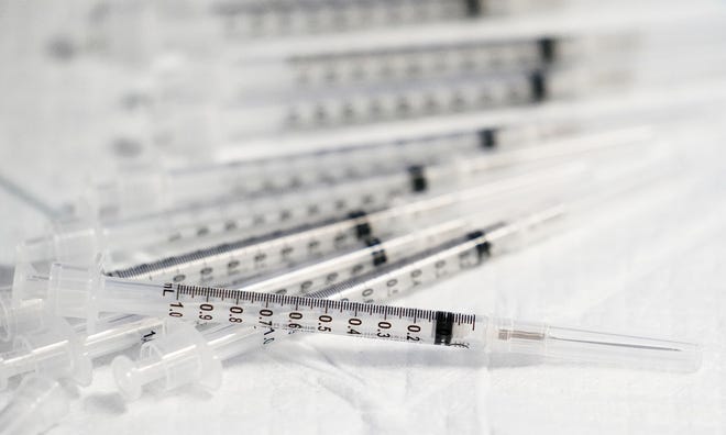 Syringes filled with the Pfizer-BioNTech COVID-19 vaccine for ages 5 to 11 are shown at Native Health Central clinic in Phoenix on Nov. 5, 2021.