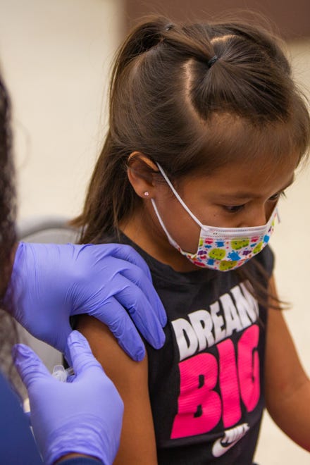 Emma Jaime, 6, gets her COVID-19 vaccination at John F. Long Elementary School in Phoenix Ariz. on Nov. 5, 2021.