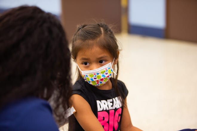 Emma Jaime, 6, gets her COVID-19 vaccination at John F. Long Elementary School in Phoenix, Ariz. on Nov. 5, 2021.