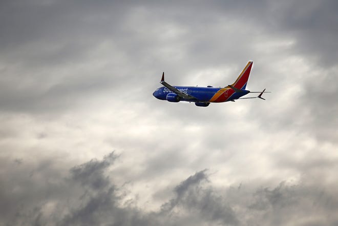 A Southwest plane makes its way from Phoenix Sky Harbor International Airport on the Wednesday before Thanksgiving on Nov. 23, 2021, in Phoenix.
