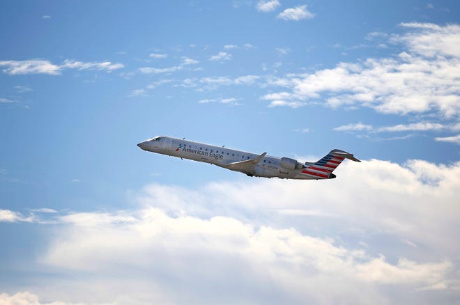 An American Airlines plane makes its way from Phoenix Sky Harbor International Airport on the Wednesday before Thanksgiving on Nov. 23, 2021, in Phoenix.