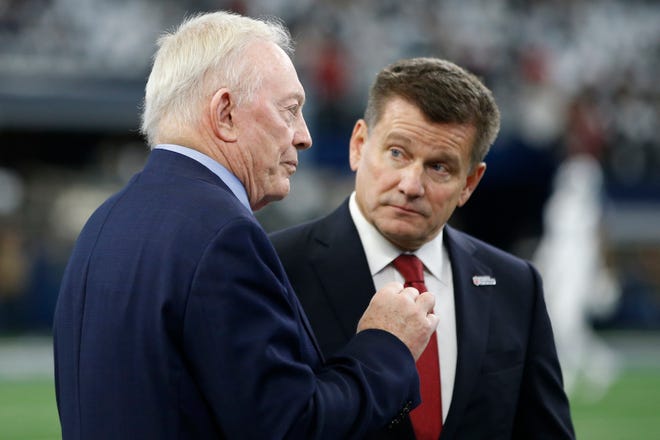 Dallas Cowboys owner Jerry Jones (L) and Arizona Cardinals owner Michael Bidwill (R) talk before the game at AT&T Stadium in Arlington, Texas, Jan. 2, 2022.