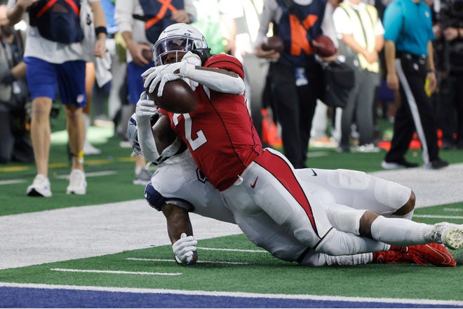 Arizona Cardinals running back Chase Edmonds (2) is tackled by Dallas Cowboys' Micah Parsons during the first half of an NFL football game Sunday, Jan. 2, 2022, in Arlington, Texas. (AP Photo/Michael Ainsworth)