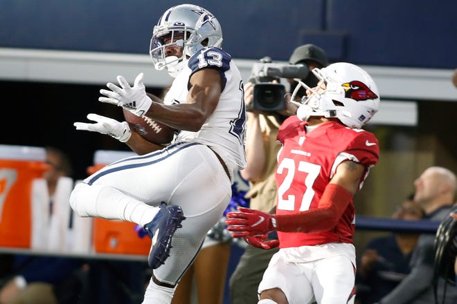 Jan 2, 2022; Arlington, Texas, USA; Dallas Cowboys wide receiver Michael Gallup (13) catches a touchdown pass against Arizona Cardinals cornerback Luq Barcoo (27) in the second quarter at AT&T Stadium. Mandatory Credit: Tim Heitman-USA TODAY Sports