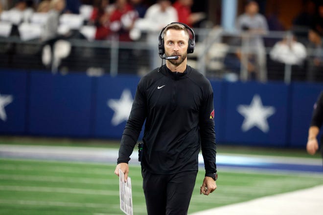 Arizona Cardinals head coach Kliff Kingsbury watches from the sideline during the first half of an NFL football game against the Dallas Cowboys Sunday, Jan. 2, 2022, in Arlington, Texas. (AP Photo/Michael Ainsworth)