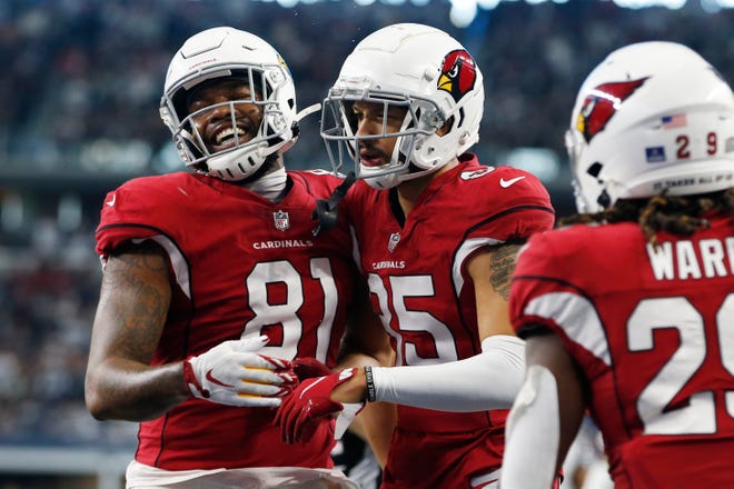 Jan 2, 2022; Arlington, Texas, USA; Arizona Cardinals Antoine Wesley (85) and tight end Darrell Daniels (81) celebrate a touchdown in the second quarter against the Dallas Cowboys at AT&T Stadium. Mandatory Credit: Tim Heitman-USA TODAY Sports