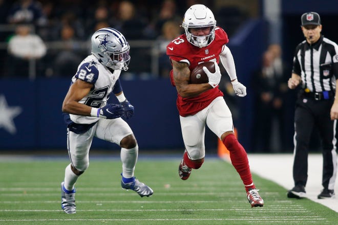 Arizona Cardinals wide receiver Christian Kirk (13) runs with the ball after a catch against Dallas Cowboys cornerback Kelvin Joseph (24) in the third quarter at AT&T Stadium.