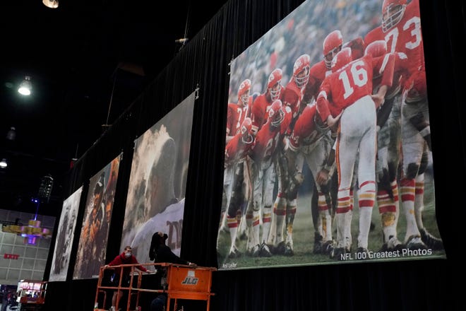 Historic photographs are displayed in a mural format inside the NFL Experience, an interactive fan show at the Los Angeles Convention Center in Los Angeles. The Los Angeles Rams play the Cincinnati Bengals in the Super Bowl on Sunday in Inglewood.