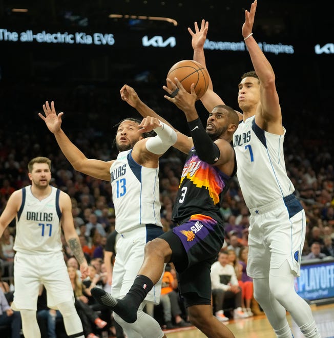 May 4, 2022; Phoenix, Ariz., U.S.; Phoenix Suns guard Chris Paul (3) is defended by Dallas Mavericks guard Jalen Brunson (13) and center Dwight Powell (7) during Game 2 of the Western Conference semifinals at Footprint Center.