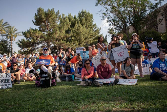 Hundreds of people gathered outside the Arizona Capitol on June 11, 2022, in Phoenix as part of a nationwide demonstration calling for stricter gun laws in response to recent mass shootings.