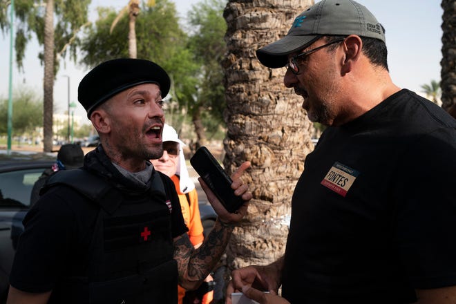 Adrian Fontes, candidate for Arizona Secretary of State, right, argues with a counter-protester during the annual March for Our Lives protest, a nationwide demonstration in support of gun control legislation, at the Arizona State Capitol on Saturday, June 11, 2022.