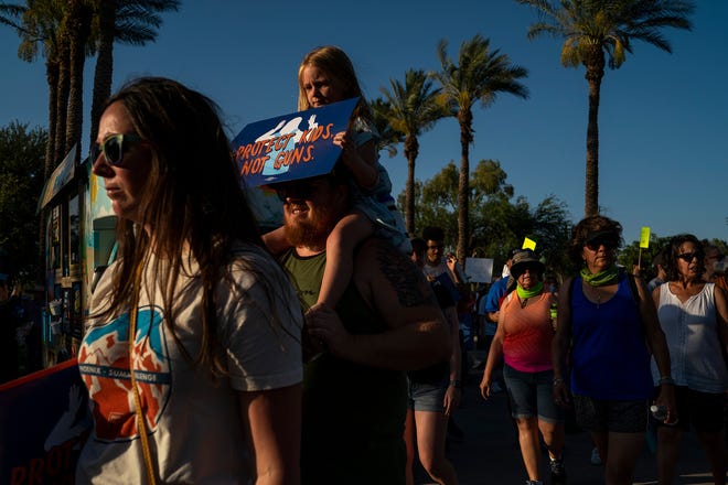 Protesters return to the Arizona State Capitol after marching during the annual March for Our Lives protest, a nationwide demonstration in support of gun control legislation, on Saturday, June 11, 2022.