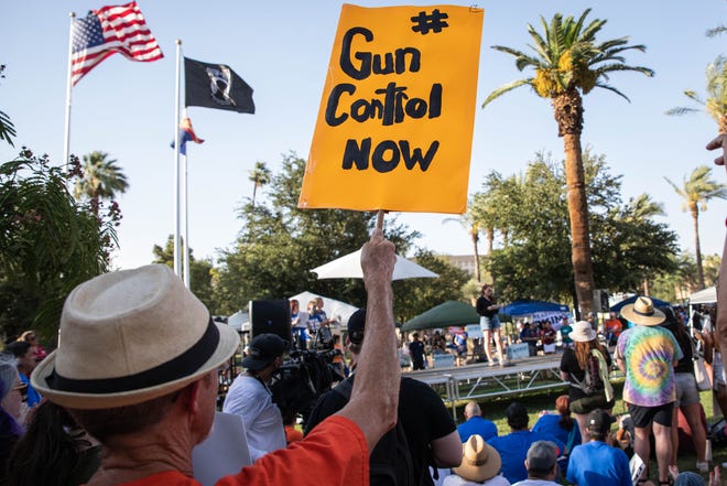Hundreds of people gathered outside the Arizona Capitol as part of a nationwide demonstration calling for stricter gun laws in response to recent mass shootings on June 11, 2022, in Phoenix.