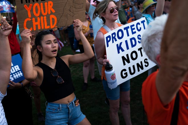 Jasmine Thompson (left) cheers as Rep. Jennifer Longdon asked the crowd "Are you angry," during the annual March for Our Lives protest, a nationwide demonstration in support of gun control legislation, at the Arizona State Capitol on Saturday, June 11, 2022.