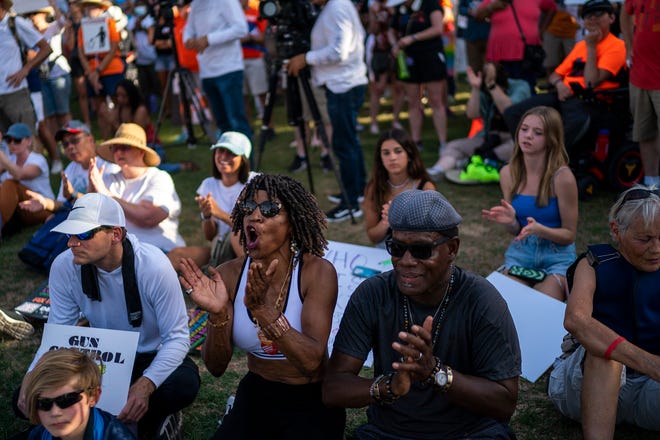 Wanda Wright, center left, cheers as counter-protesters attempt to disrupt speeches during the annual March for Our Lives protest, a nationwide demonstration in support of gun control legislation, at the Arizona State Capitol on Saturday, June 11, 2022.