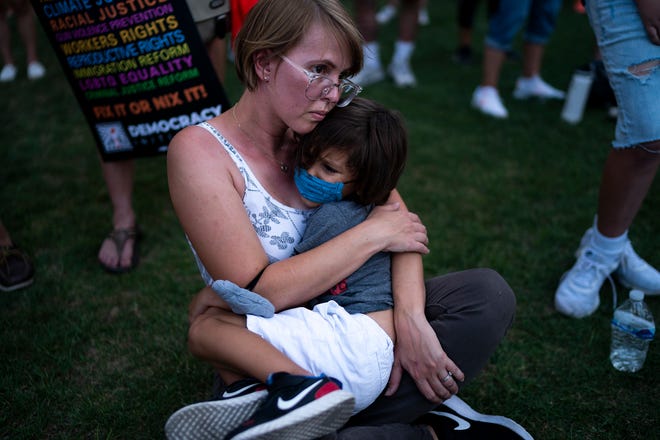 Jennifer Villalpando holds her son Andreo, 4, before they march during the annual March for Our Lives protest, a nationwide demonstration in support of gun control legislation, at the Arizona State Capitol on Saturday, June 11, 2022.