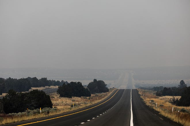 The view on Highway 89 heading north is obscured with heavy smoke Wednesday, June 15, 2022, as the Pipeline Fire continues to burn outside of Flagstaff. The highway is closed to through traffic as fire crews work to contain the fire.