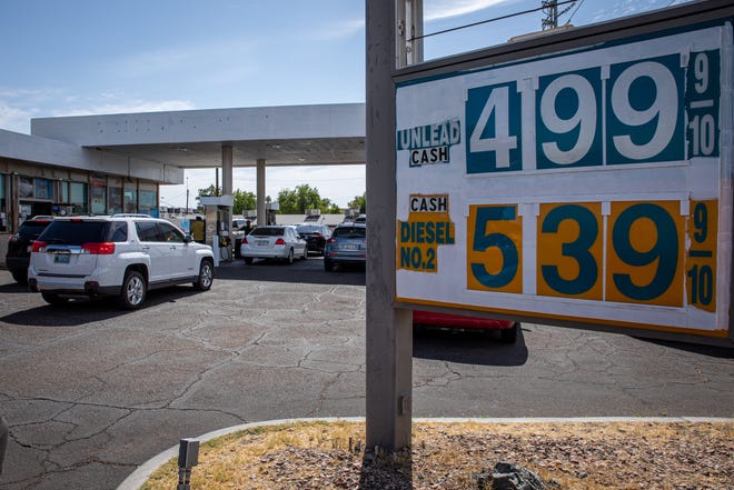Customers line up for cheaper gas prices at the station on the corner of 20th Street and Osborn Road in Phoenix on June 21, 2022.