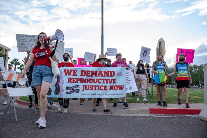 Thousands of people march outside the Arizona Capitol in Phoenix to protest the Supreme Court decision in Dobbs v. Jackson Women's Health Organization on June 24, 2022. The court's decision overturns the nearly 50-year-old Roe v. Wade ruling, which established the legal right to abortion in the country.